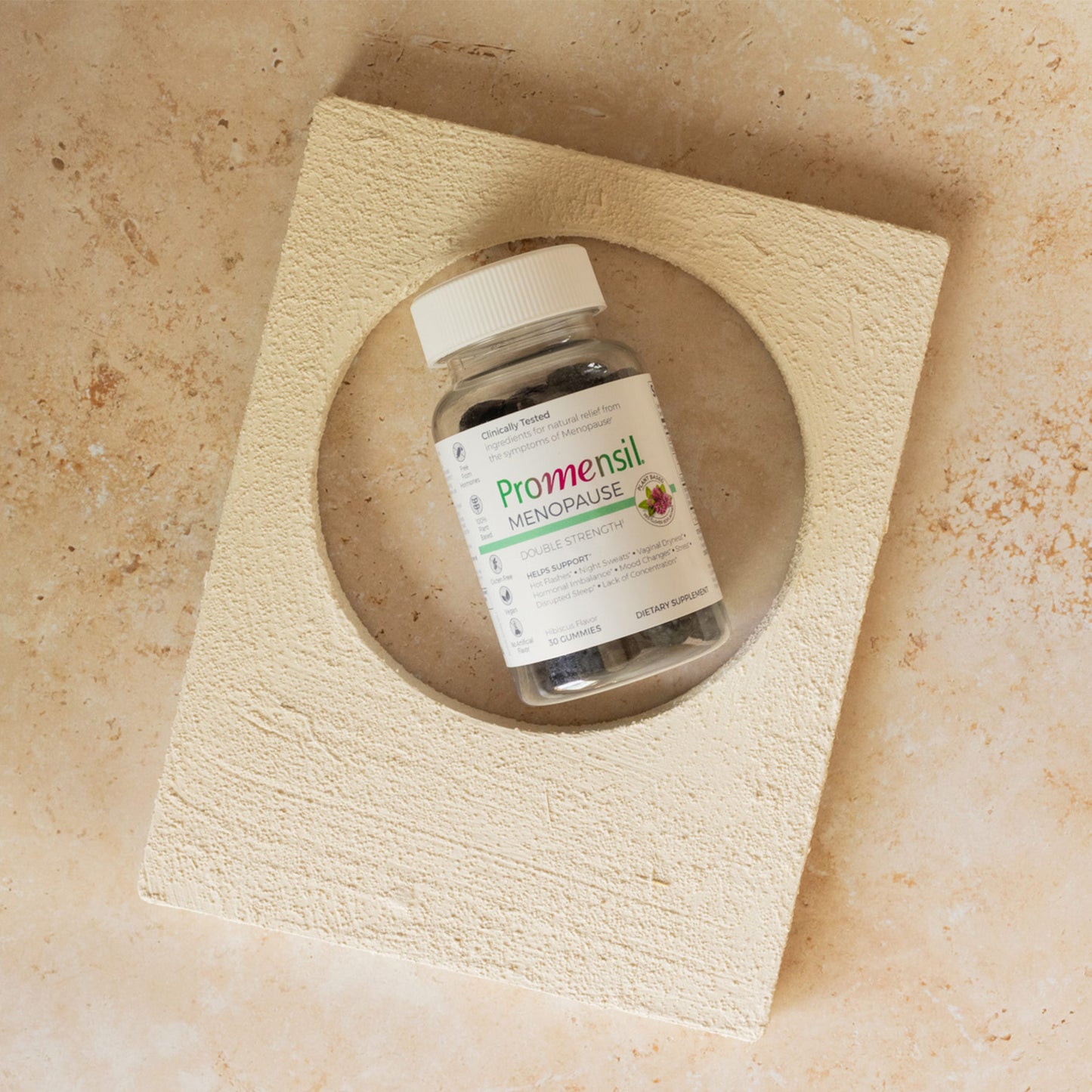 Promensil Menopause Double Strength Gummies bottle on a stone surface