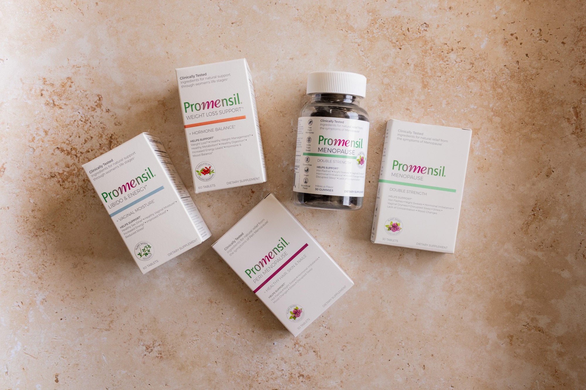 Promensil Menopause Products on beige stone background 